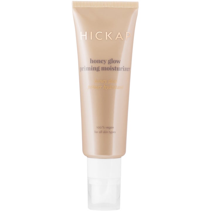 Hickap Honey Glow Priming Moisturizer fuktighetsgivende primer som gir glød i en beige tube med klar kork.