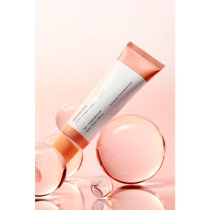 Mixsoon PDRN Collagen Cream 50 ml ansiktskrem i hvit tube med ferskenfarget kork blant gjennomsiktige kuler