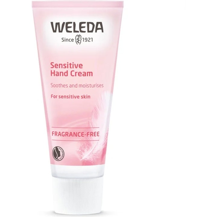 Weleda Sensitive Hand Cream beroligende håndkrem for sensitiv hud i en lys rosa tube med hvit kork og fjærmotiv.