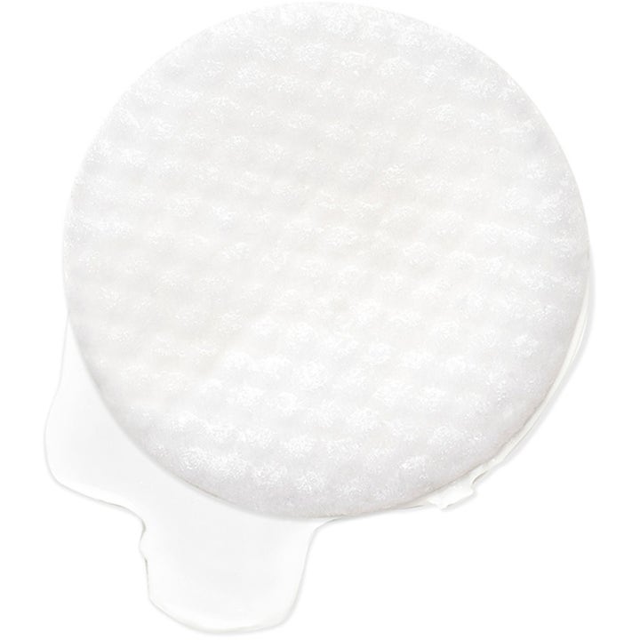 Exuviance Daily Resurfacing Peel 58 ml peeling som gir glød med en hvit teksturert pad i klar væske.