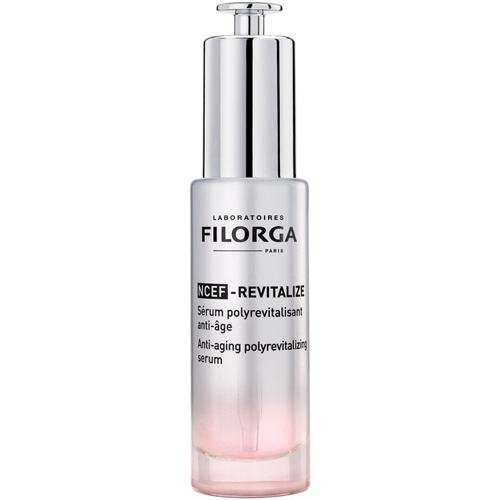 Filorga NCEF-REVITALIZE Serum anti-aging som gir glød i frostet glassflaske med sølvpumpe og rosa gradient