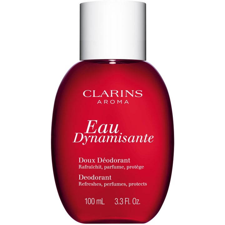 Clarins Eau Dynamisante 100 ml deodorant som gir friskhet og beskyttelse i en rød avrundet flaske med hvitt lokk