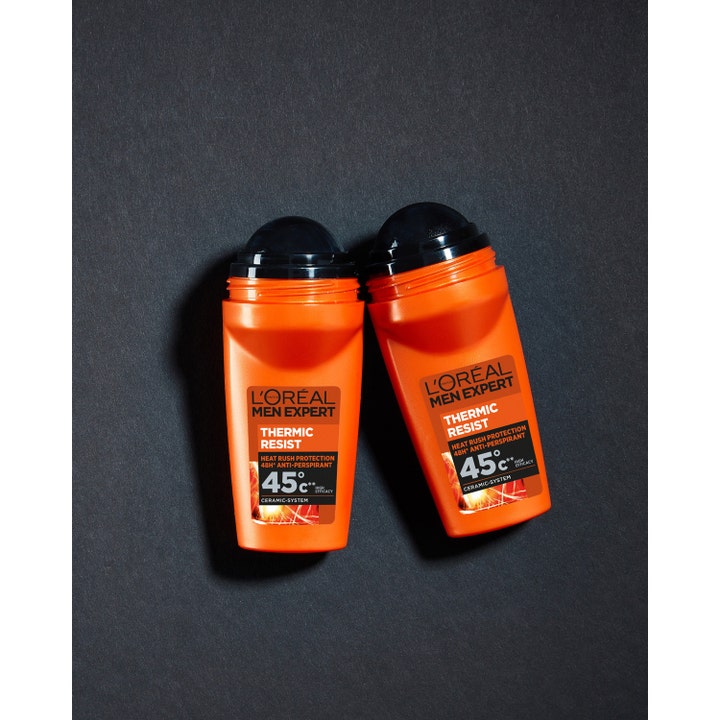 L'Oréal Paris Men Expert Thermic Resist 50 ml roll-on gir 48h beskyttelse vist som to oransje flasker på mørk bakgrunn