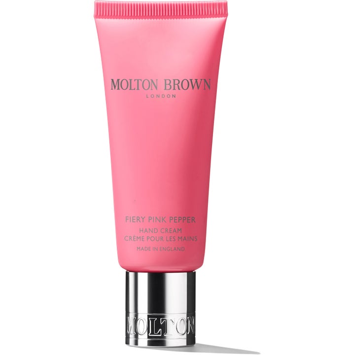 Molton Brown Fiery Pink Pepper Hand Cream fuktighetsgivende håndkrem i knallrosa tube med glinsende sølvkork.