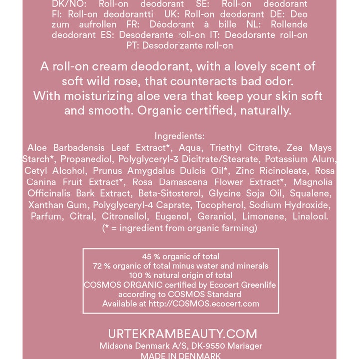 Urtekram Soft Wild Rose 50 ml roll-on deodorant med hvit tekst som viser ingredienser på rosa bakgrunn