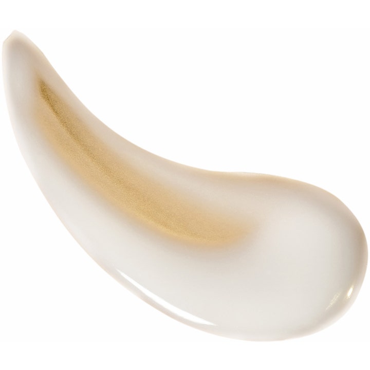 Garnier Ambre Solaire Ideal Bronze Milk-in-Spray 150 ml solkrem med hvit kremet tekstur og en stripe gyllent skimmer