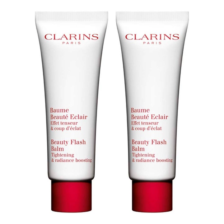 Clarins Beauty Flash Balm oppstrammende ansiktsbalm som gir glød i to hvite tuber med røde korker