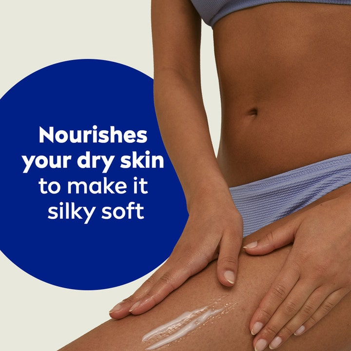 NIVEA Rich Nourishing Body Lotion 400 ml påføres tørr hud på lår for en silkemyk og fuktet følelse.