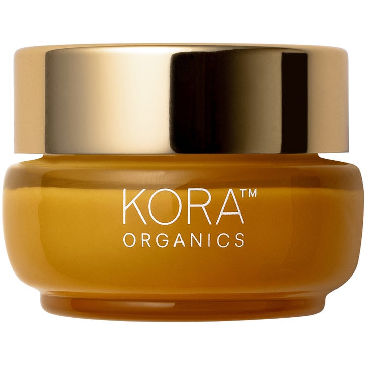 Kora Organics Turmeric Glow Moisturizer 50 ml fuktighetskrem i en gul glasskrukke med gullfarget lokk.