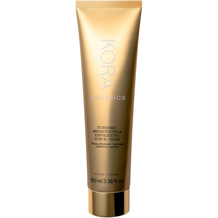 Kora Organics Turmeric Brightening & Exfoliating Scrub + Mask 100 ml glødgivende ansiktsmaske i gullfarget tube.