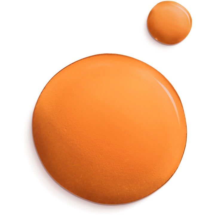 Lancaster Sun Beauty Dry Body Oil 150 ml SPF30 solbeskyttelse med en glansfull oransje oljetekstur i dråper.