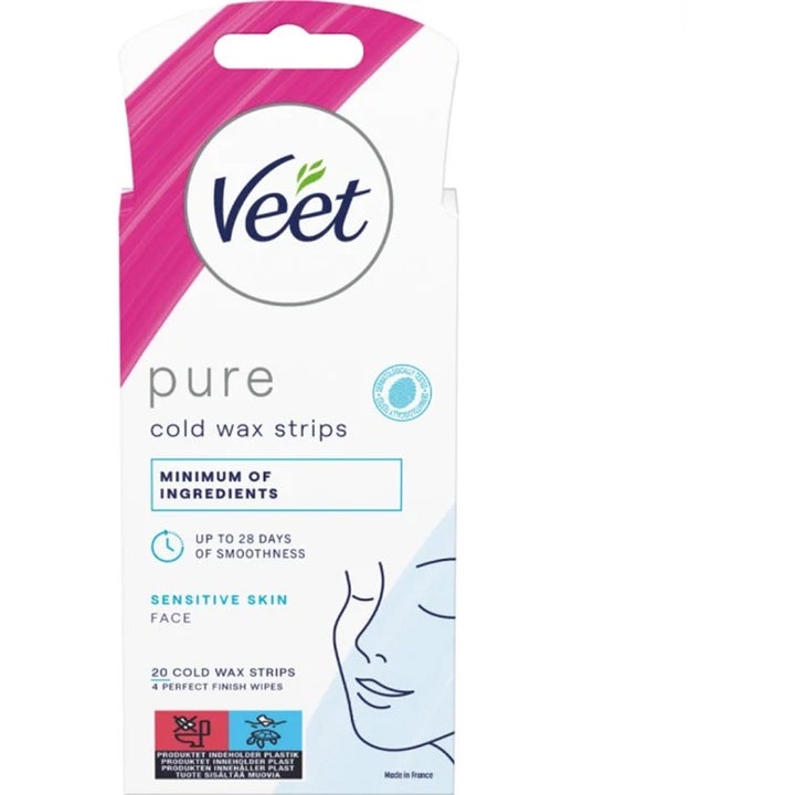 Veet Pure Cold Wax Strips Face 20 stk kaldvoksstrips for sensitiv hud i hvit pakning med rosa mønster og ansiktstegning.