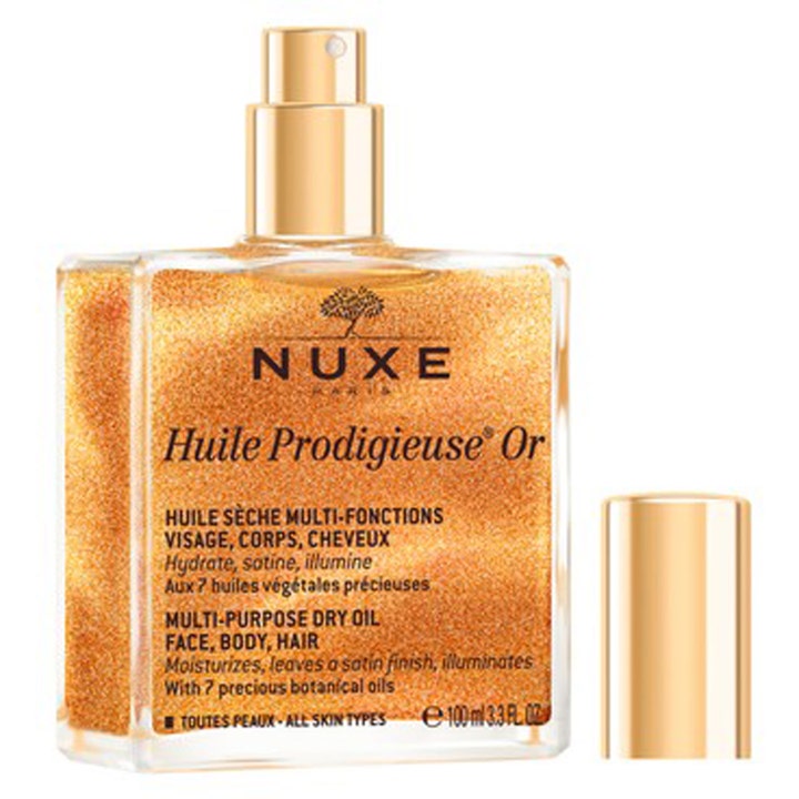 Nuxe Huile Prodigieuse Or 100 ml glitrende tørrolje i glassflaske med gullkork som gir huden en strålende glød