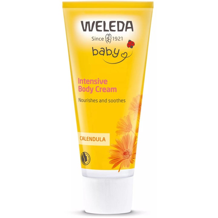 Weleda Baby Calendula Intensive Body Cream beroligende hudkrem i gul tube med ringblomst og hvit kork.
