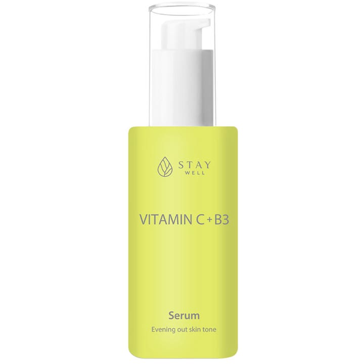 Stay Well Vitamin C + B3 Serum utjevnende ansiktsserum i en limegrønn flaske med hvit pumpe og klart lokk