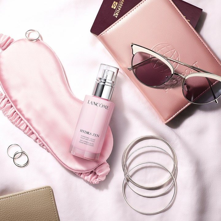 Lancôme Hydra Zen Liquid Moisturizer 50 ml fuktgivende dagkrem i rosa pumpeflaske med sovemaske og solbriller