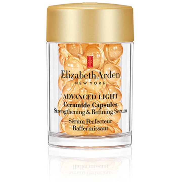 Elizabeth Arden Advanced Light Ceramide Capsules styrkende serum i klar krukke med gulllokk og gyldne kapsler.