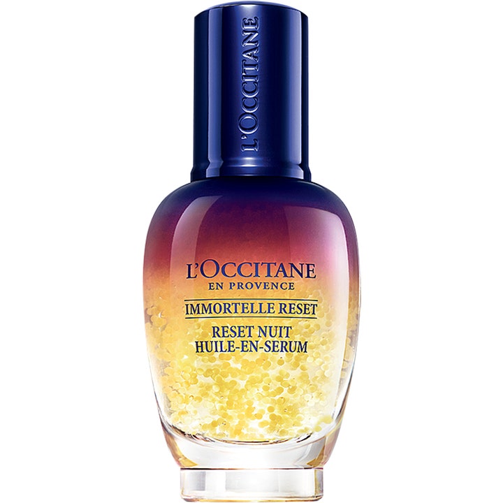 L'Occitane Immortelle Reset 30 ml revitaliserende nattserum i lilla og ravgul glassflaske med gylne oljeperler