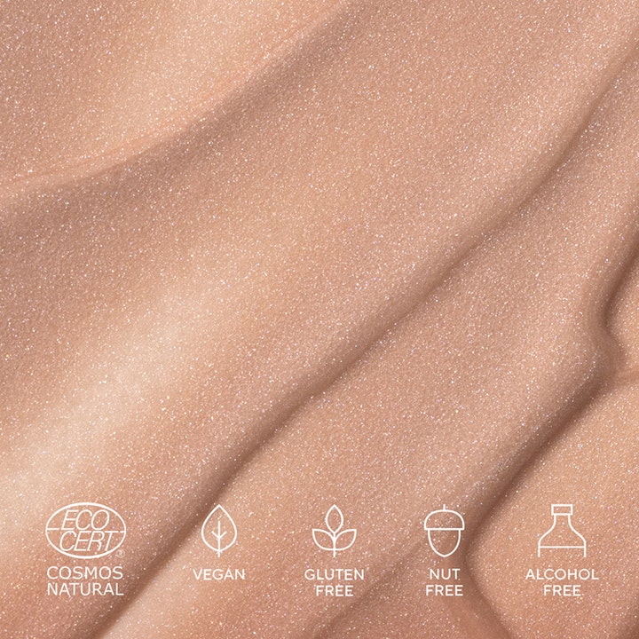 MÁDARA H2O Tint Hyaluron Tinted Serum 30 ml gir glød med en skimrende beige tekstur som er vegansk.