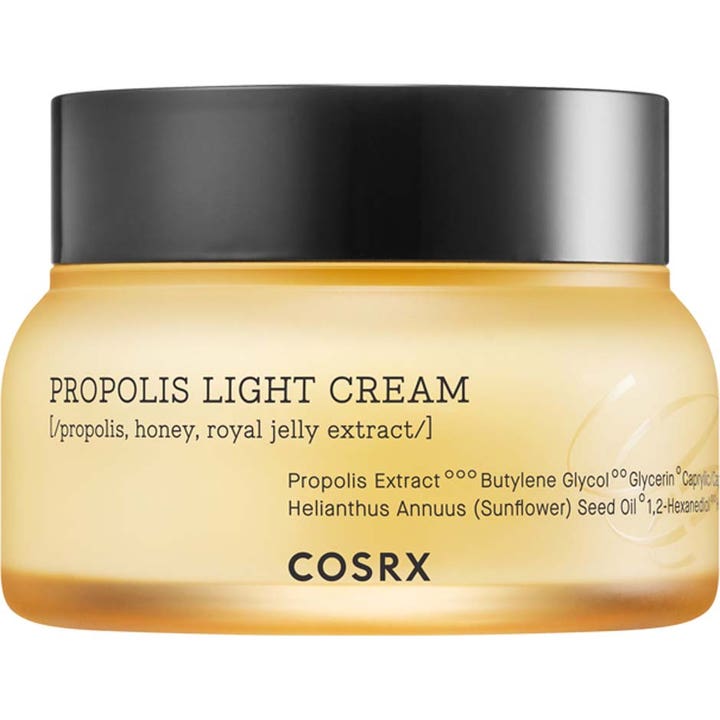 COSRX Propolis Light Cream 65 ml fuktighetskrem med honning som gir glød i en gul krukke med svart lokk