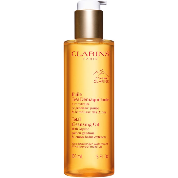 Clarins Total Cleansing Oil 150 ml renseolje fjerner vannfast sminke i klar flaske med gyllen olje og hvit pumpe.