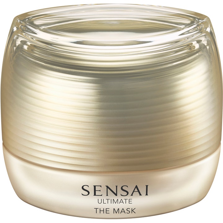 Sensai Ultimate The Mask 75 ml pleiende ansiktsmaske i en luksuriøs gullfarget krukke med rillet overflate.