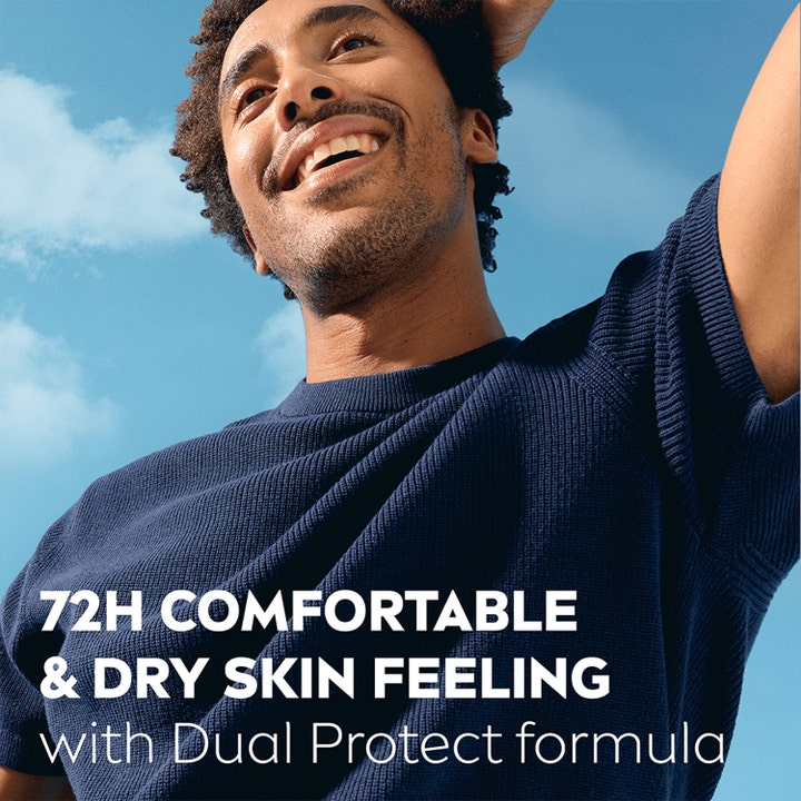 NIVEA MEN Dry Impact Roll-On Deodorant 50 ml gir 72t tørr hudfølelse vist med en smilende mann mot blå himmel