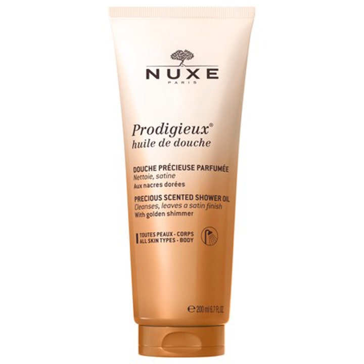 Nuxe Prodigieux Huile de Douche 200 ml dusjolje med gullskimmer som gir huden satengfinish i en beige og bronsefarget tube