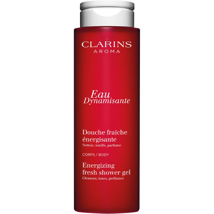 Clarins Eau Dynamisante Energizing Fresh Shower Gel 200 ml i en dyp rød sylindrisk flaske med sølvfarget kork.