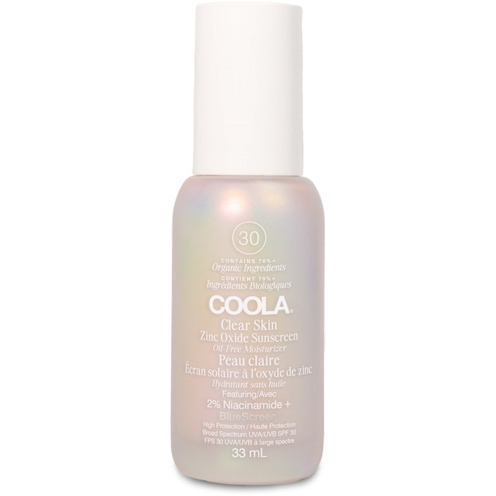 Coola Clear Skin Zinc Oxide Sunscreen 33 ml oljefri solkrem i en skimrende perlemorsfarget glassflaske med hvit kork.