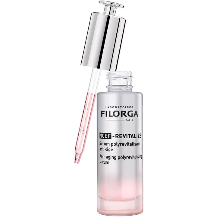 Filorga NCEF-Revitalize Serum 30 ml revitaliserende ansiktsserum i sølvflaske med rosa bunn og åpen pipette