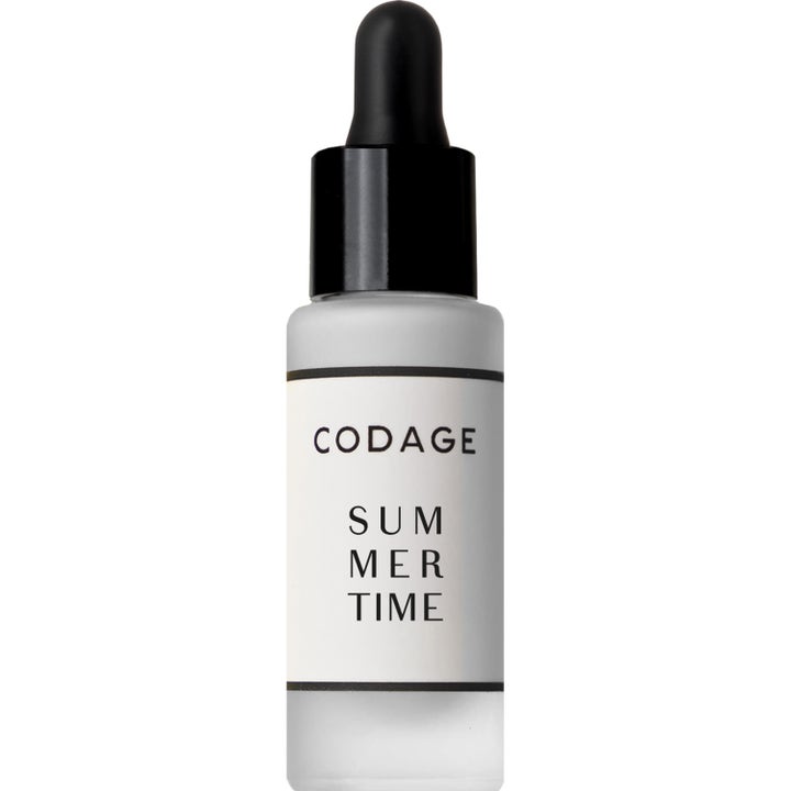 Codage Summer Time ansiktsserum som beskytter huden i en frostet glassflaske med svart pipette