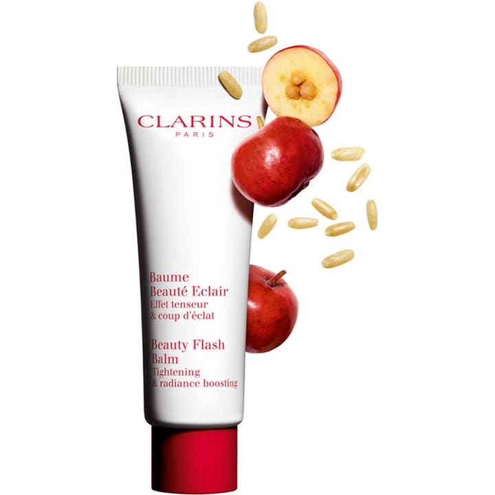 Clarins Beauty Flash Balm 50 ml oppstrammende dagkrem i hvit tube med rødt lokk omgitt av røde bær og korn