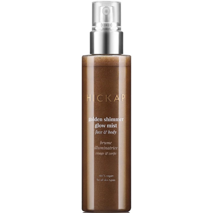 Hickap Golden Shimmer Glow Mist glødgivende spray for ansikt og kropp med skimrende bronsefarget væske og sølvpumpe.