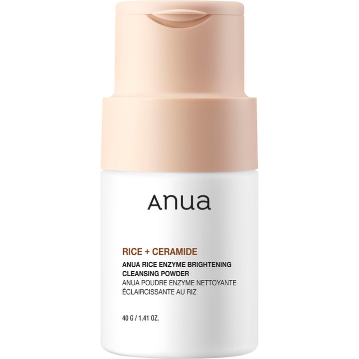 Anua Rice Enzyme Brightening Cleansing Powder 40 g opplysende ansiktsrens i hvit flaske med ferskenfarget lokk
