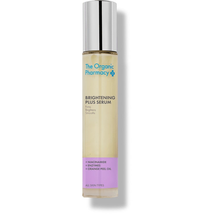 The Organic Pharmacy Brightening Plus Serum gir glød med niacinamid i en slank glassflaske med sølvkork og lilla etikett.