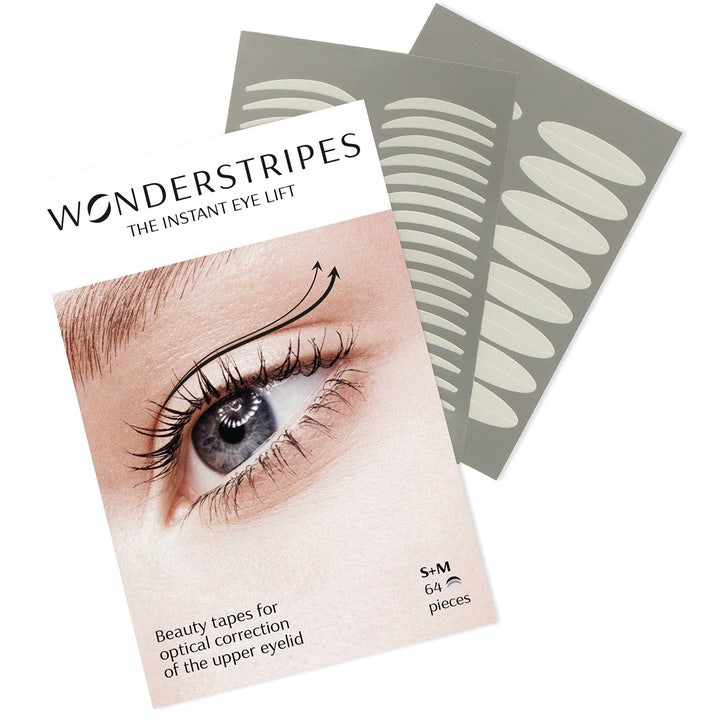 Wonderstripes The Instant Eye Lift 64 stk korrigerende øyelokk-tapes gir et løft vist med grå ark og hvit pakning.
