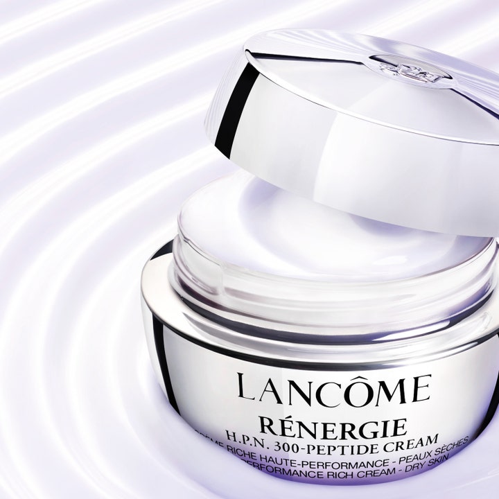 Lancôme Rénergie H.P.N. UVMUNE Cream SPF50 50 ml ansiktskrem i sølvfarget krukke med hvit tekstur og lilla bakgrunn