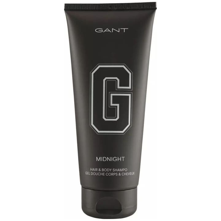 Gant Midnight Hair & Body Shampoo rensende dusjgelé i en matt sort tube med en stor ikonisk G-logo i sølv.