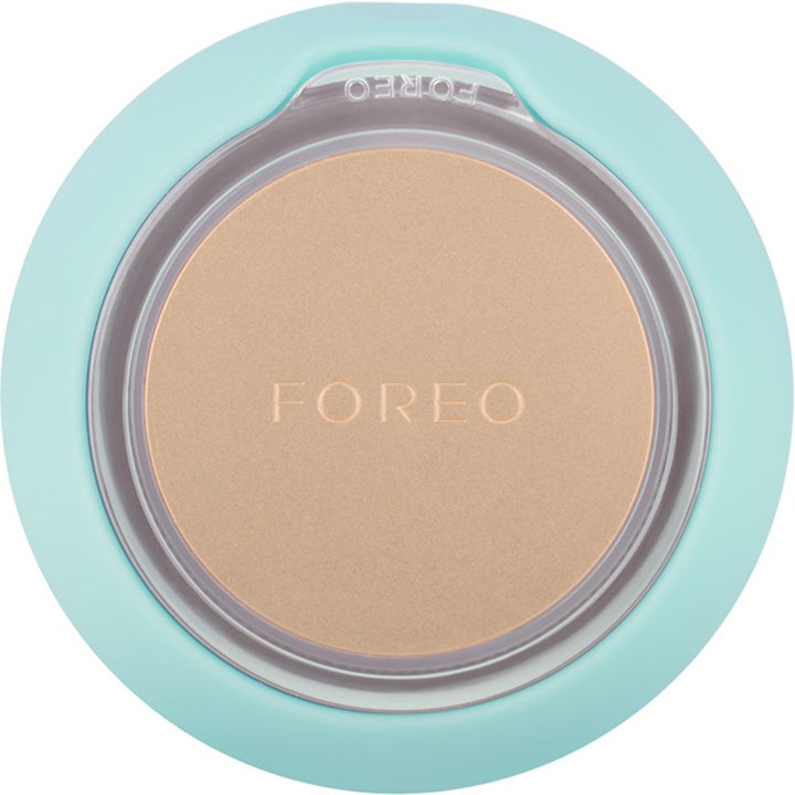 FOREO UFO 2 Mint hudpleie som gir glød i en mintgrønn silikonenhet med rund plate i børstet gullmetall