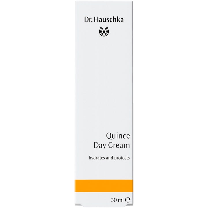 Dr. Hauschka Quince Day Cream 30 ml fuktighetsgivende dagkrem i hvit eske med en oransje stripe som beskytter huden.