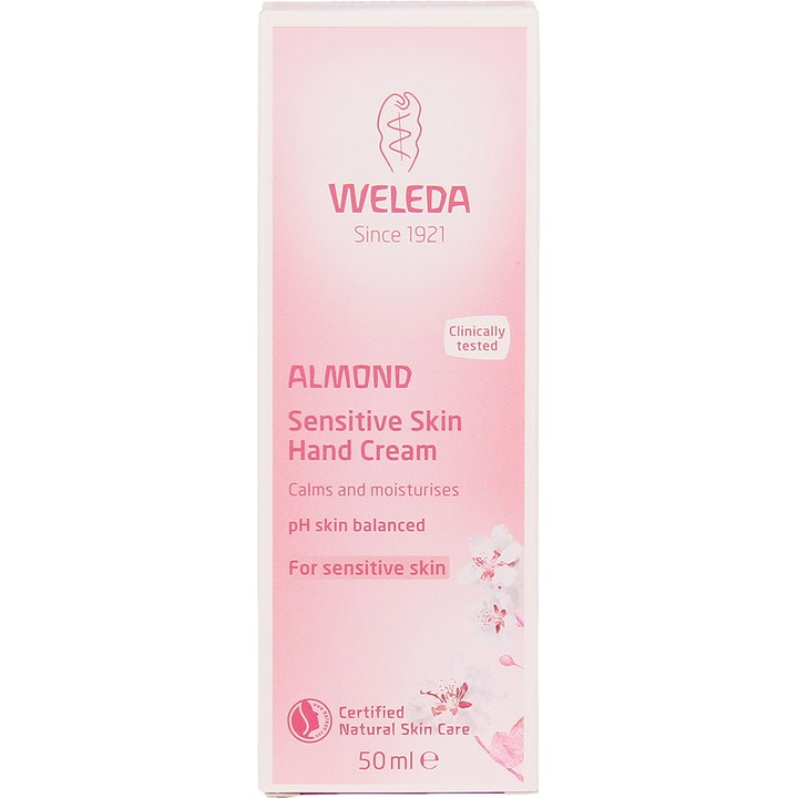 Weleda Almond Sensitive Hand Cream 50 ml beroligende handkrem i hvit og rosa eske dekorert med mandelblomster.