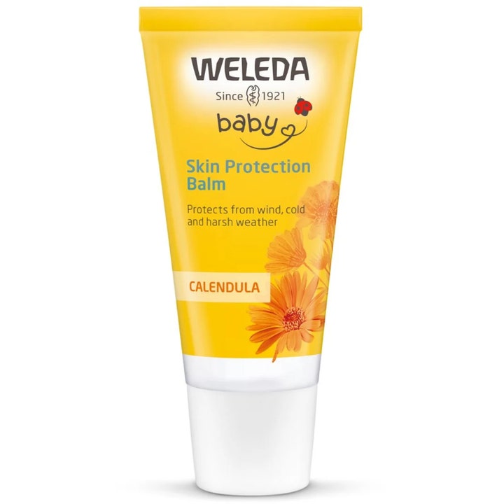 Weleda Baby Skin Protection Balm 30 ml beskyttende kuldekrem i gul tube med ringblomstdekor.