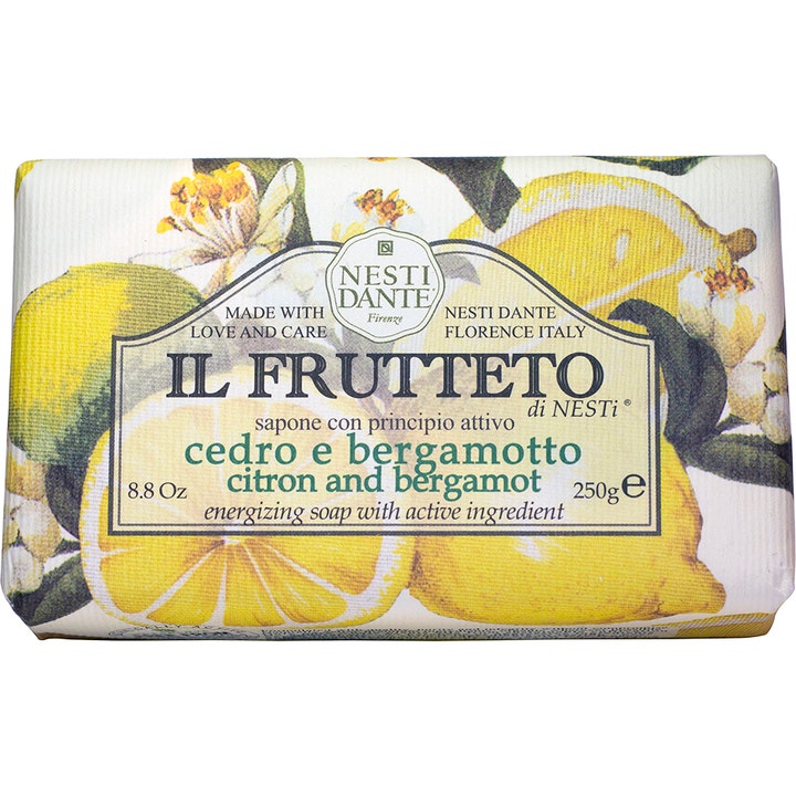 Nesti Dante Il Frutteto Citron and Bergamot 250g energigivende fast såpe i papir med dekorative gule sitroner og hvite blomster.