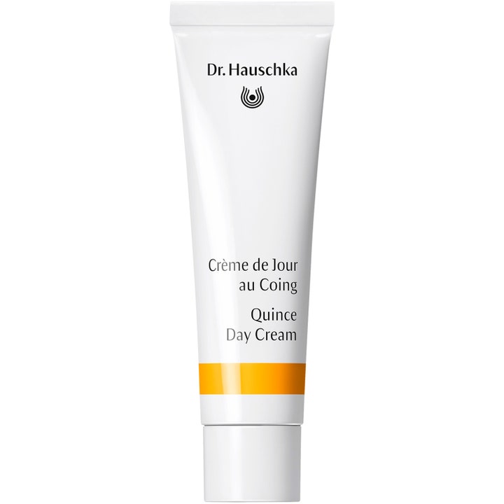 Dr. Hauschka Quince Day Cream fuktighetsgivende ansiktskrem i hvit tube med sort tekst og en oransje stripe