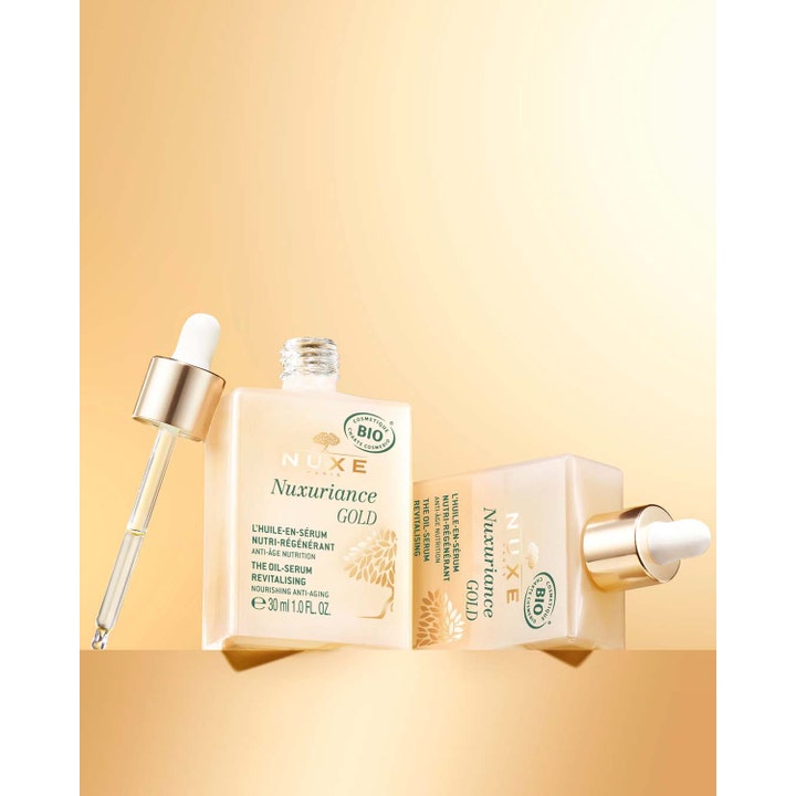 Nuxe Nuxuriance Gold 30 ml nærende oljeserum i firkantet glassflaske med pipette og gullfarget kork.