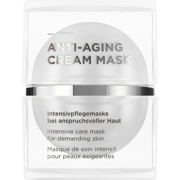 Anti-Aging Cream Mask oppstrammende ansiktsmaske i hvit kuleformet krukke i klar firkantet beholder med sølvdetaljer