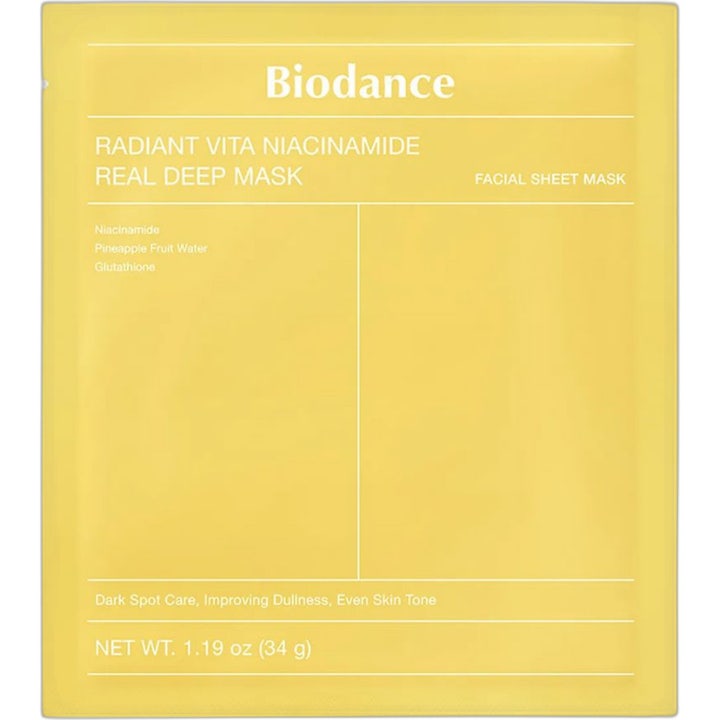 Biodance Radiant Vita Niacinamide Real Deep Mask 1 stk 34 g gir glød med hvit maske som stikker ut av gul forpakning