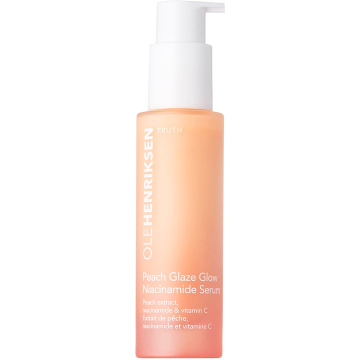 Olehenriksen Peach Glaze Glow Niacinamide Serum med vitamin C gir glød i en ferskenfarget frostet flaske med hvit pumpe
