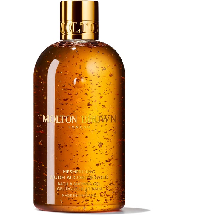 Molton Brown Mesmerising Oudh Accord & Gold dusjsåpe gir luksus med glitrende gullflak i ravfarget gel og gullkork